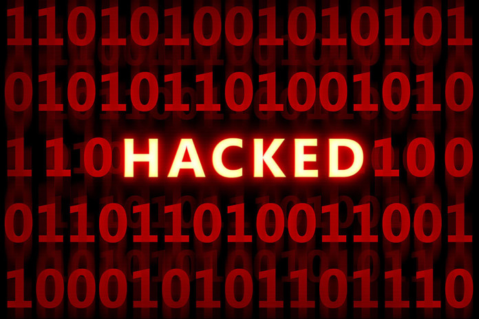 hacked middle man (2) A screen full of ones and zeros with the word hacked middle screen. It's like the matrix!