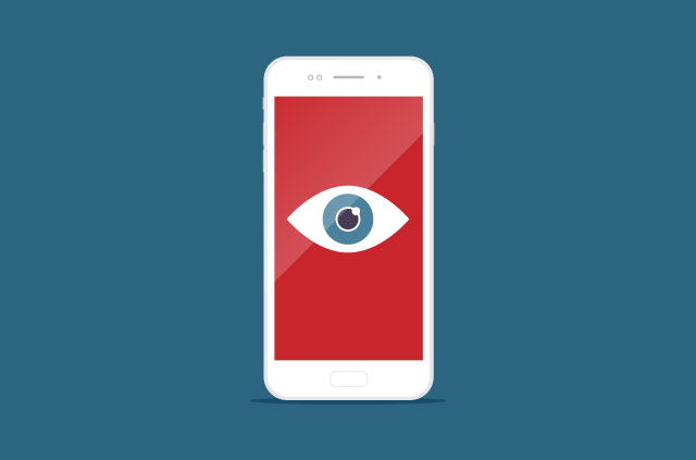 A smartphone screen with an open eye on a red background.