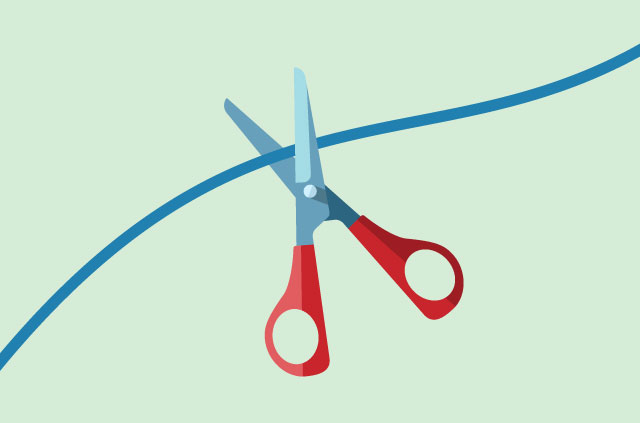 Scissors cutting through a cord.