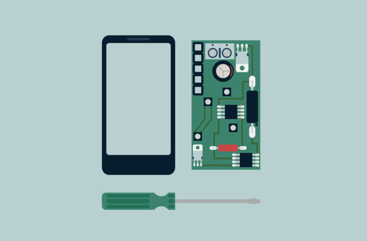 A dismantled phone and screwdriver.