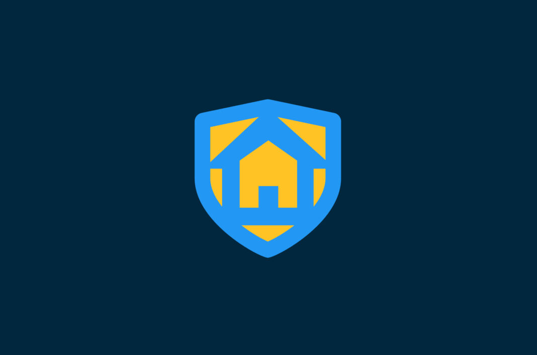 Shield with a home on it.