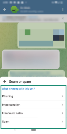 Phone screen showing how to select the relevant option when reporting a scam on Telegram.