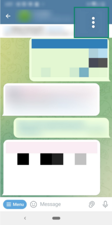 Phone screen showing how to access reporting options in Telegram.